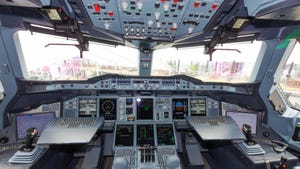 Airbus A380 cockpit, full of dials and controls and computers and joysticks