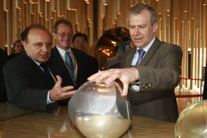 Belgian Prime Minister Yves Leterme plays with a resin Gomboc at the Hungary Pavilion in the Shanghai Expo, 2010