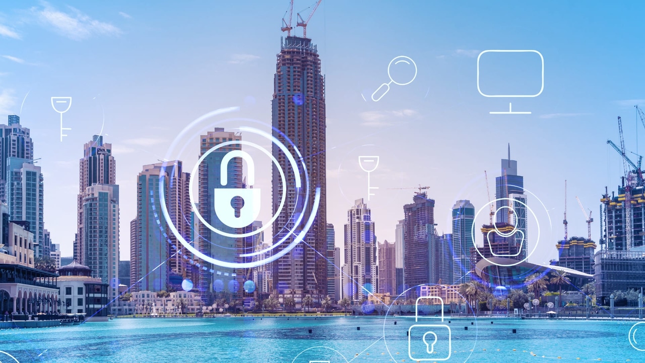 Skyline of Dubai, UAE, with cybersecurity symbols overlaid Skyline of Dubai, UAE, with cybersecurity symbols overlaid