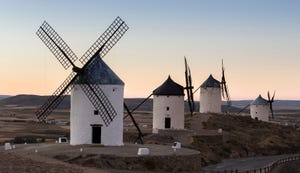 Preserved historic La Mancha windmills on hilltop above Consuegra in Castilla-La Mancha, Spain