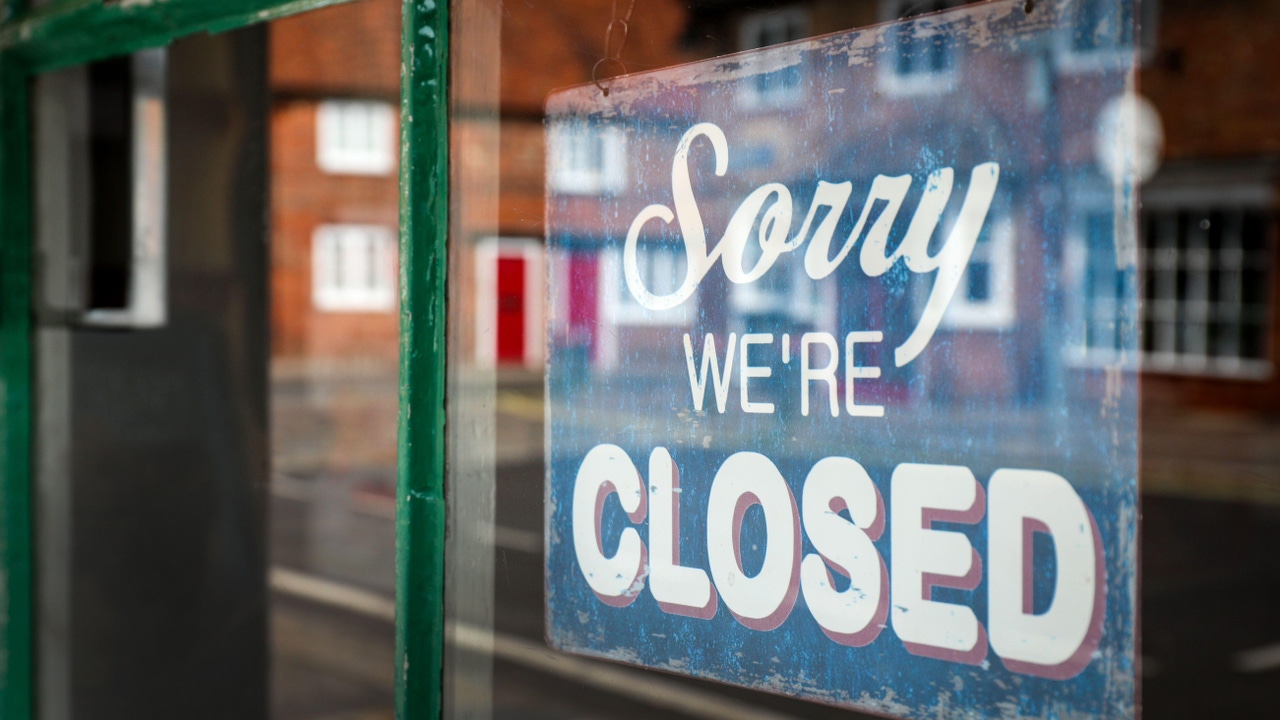 A closed sign in a shop window A closed sign in a shop window