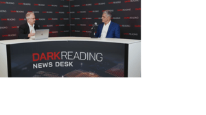 Two people talking at a news desk against a dark backdrop with "Dark Reading" written on it. Two people talking at a news desk against a dark backdrop with "Dark Reading" written on it.