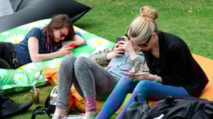 Young women on mobile phones Young women on mobile phones