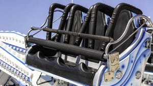 Detail of safety seats on a thrill ride at a fair in the city