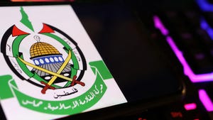 Hamas's coat of arms, on a screen, beside a keyboard Hamas's coat of arms, on a screen, beside a keyboard