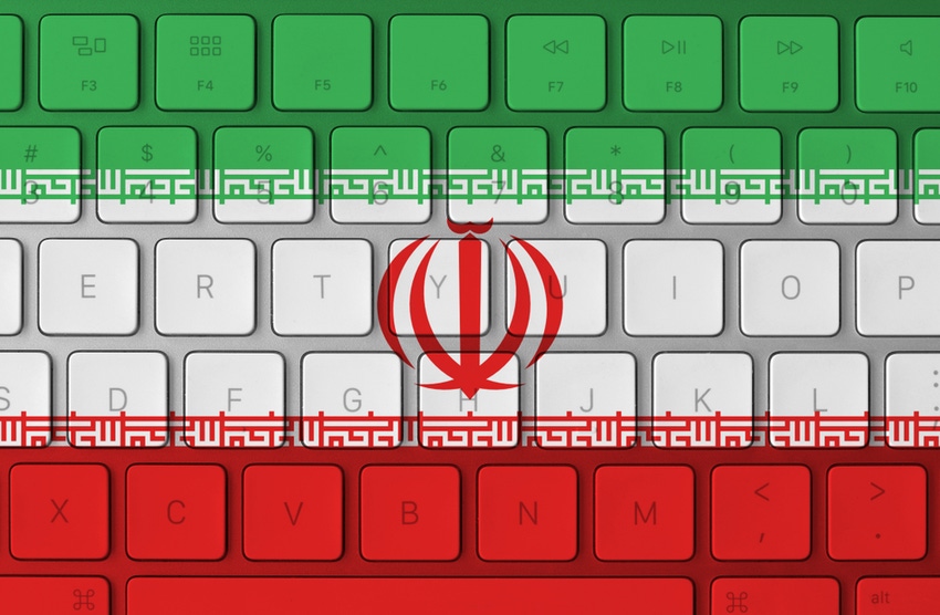 Iranian flag layered over a computer keyboard