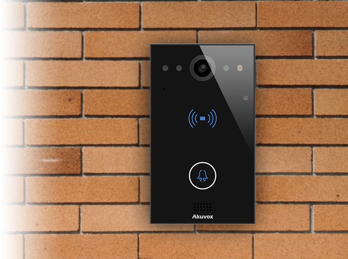 picture of the Akuvox E11 smart intercom hanging on a brick wall