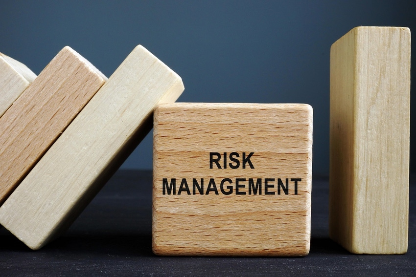 Tile with the words "risk management" on it