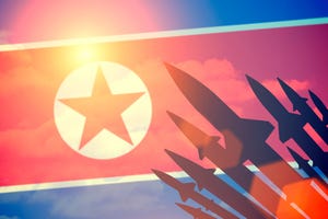 Rockets silhouettes background North Korea flag