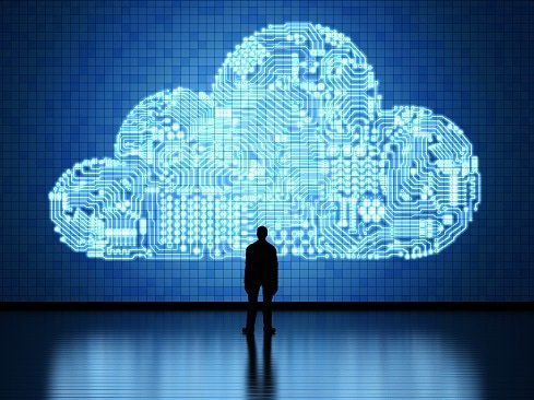 Person standing in front of a digital cloud image Person standing in front of a digital cloud image