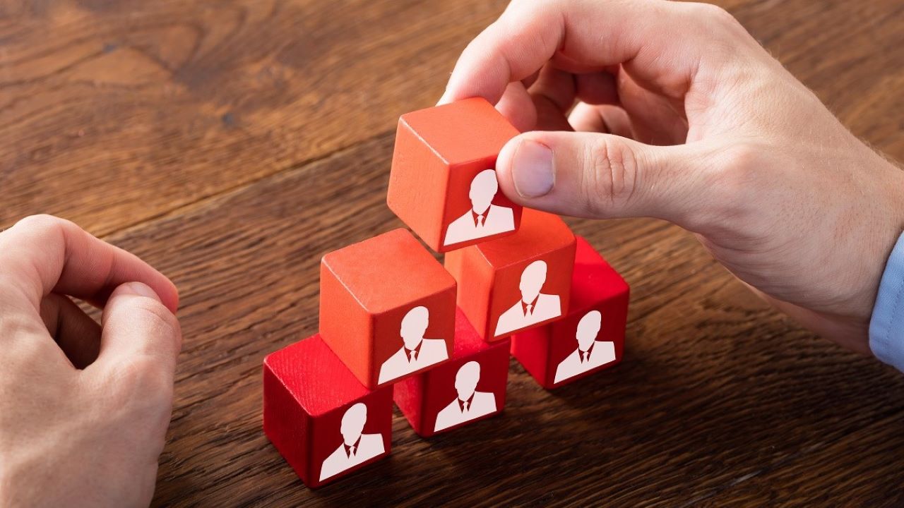 A pile of red block with silhouettes on one side. A pile of red block with silhouettes on one side.
