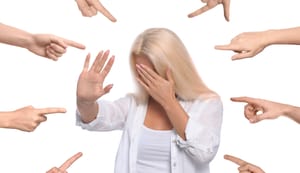 Woman shamed with fingers pointing at her Woman shamed with fingers pointing at her