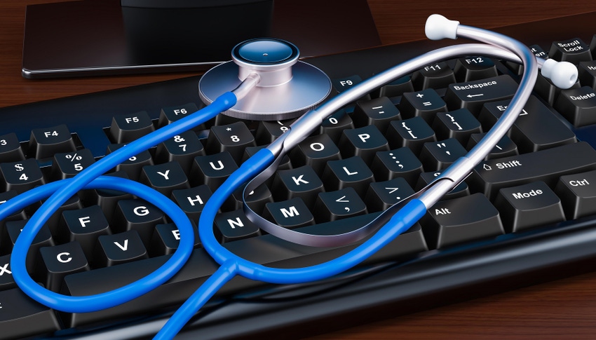 A stethoscope on top of a computer keyboard