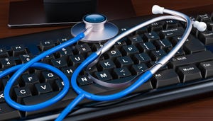 A stethoscope on top of a computer keyboard