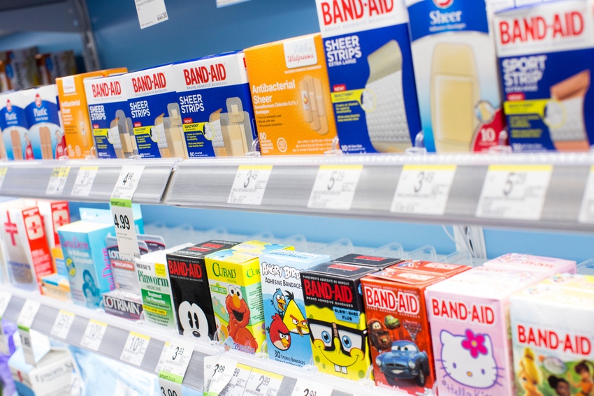 Drugstore aisle with boxes of Band-Aids