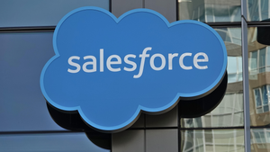 The Salesforce logo of a blue cloud with the word "salesforce" in the middle on the side of a building The Salesforce logo of a blue cloud with the word "salesforce" in the middle on the side of a building