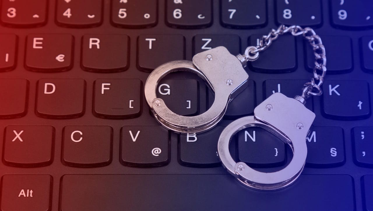 Handcuffs on a keyboard Handcuffs on a keyboard