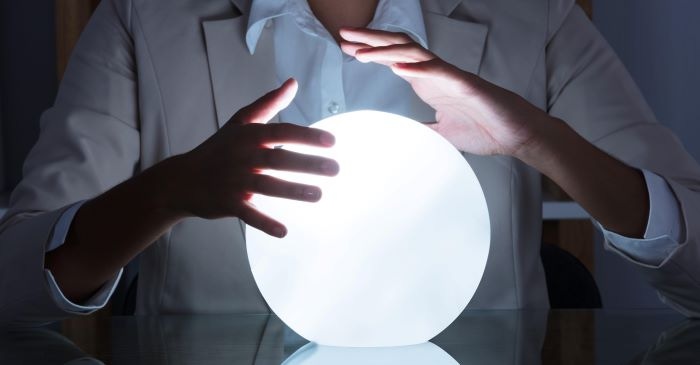 Person with a crystal ball between their hands