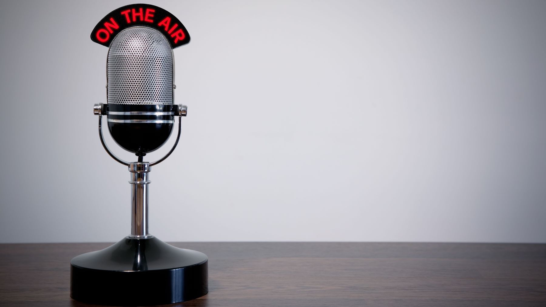 A retro microphone with On Air sign