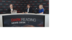 Two people talking at a news desk against a dark backdrop with "Dark Reading" written on it. Two people talking at a news desk against a dark backdrop with "Dark Reading" written on it.