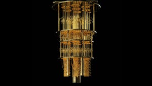 IBM's quantum computer against a black background. It looks like a gold chandelier.
