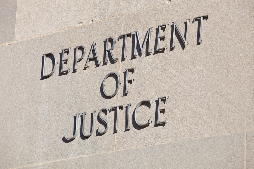 Image of Department of Justice sign outside its DC headquarters