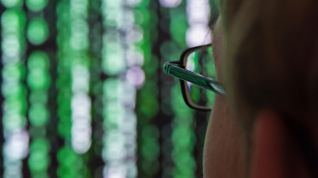 Man looking at data on screen Man looking at data on screen