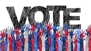 The word "vote" with red, white, and blue hands reaching up The word "vote" with red, white, and blue hands reaching up