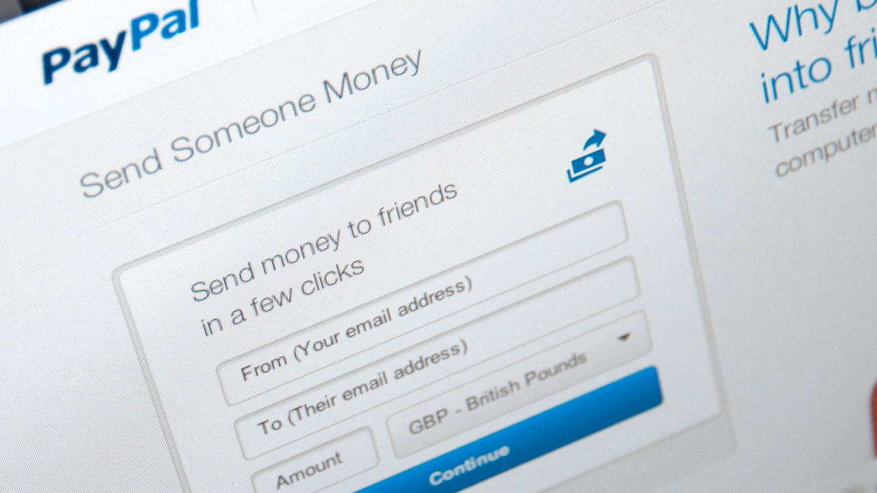 PayPal website page open on a computer screen displaying how people can send money using the service PayPal website page open on a computer screen displaying how people can send money using the service