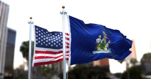 Flags of Maine and the United States beside each other