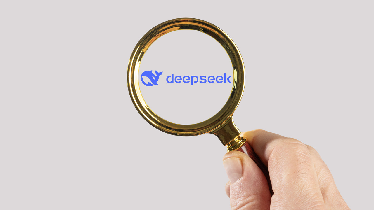 The DeepSeek logo under a magnifying glass The DeepSeek logo under a magnifying glass