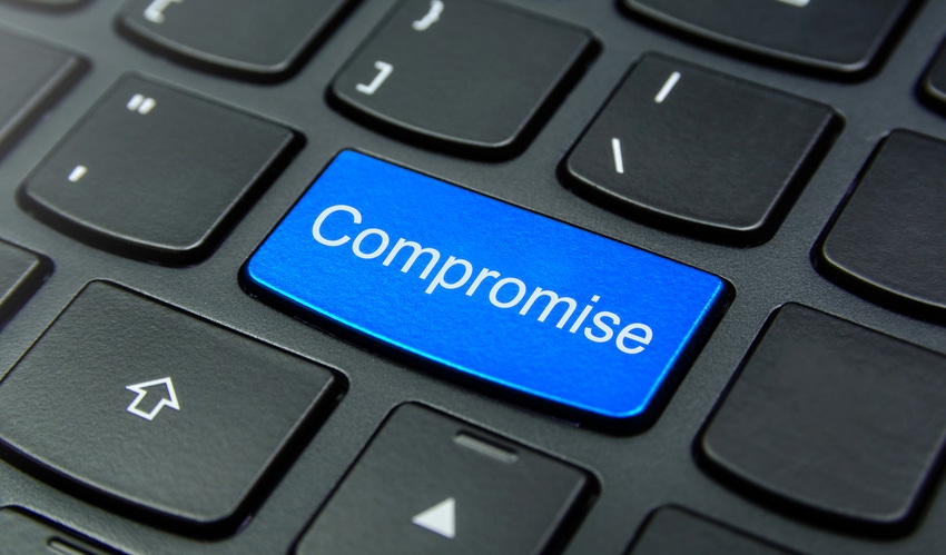 Close-up of a keyboard with the word Compromise on a key