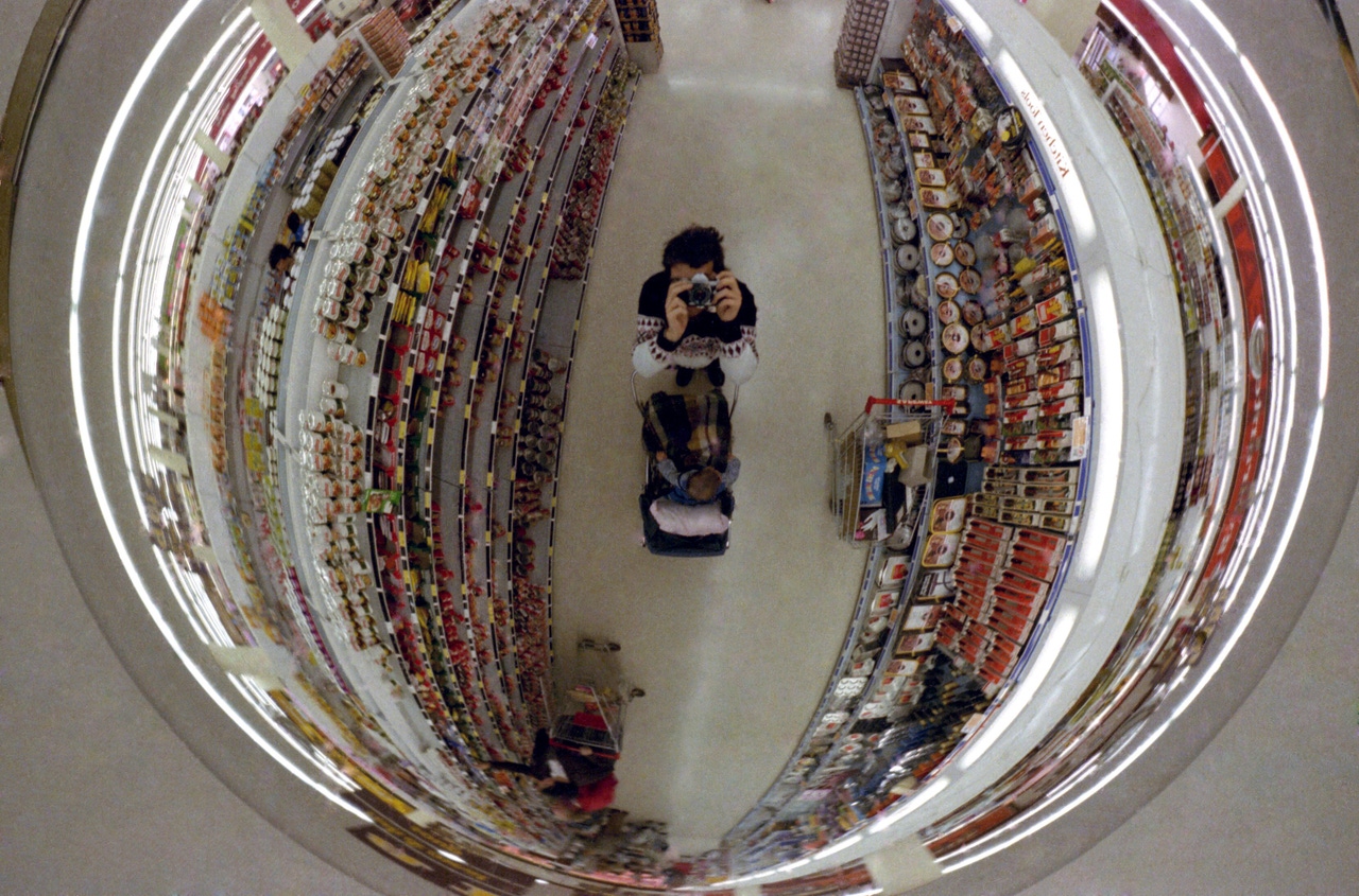 A store security mirror selfie A store security mirror selfie