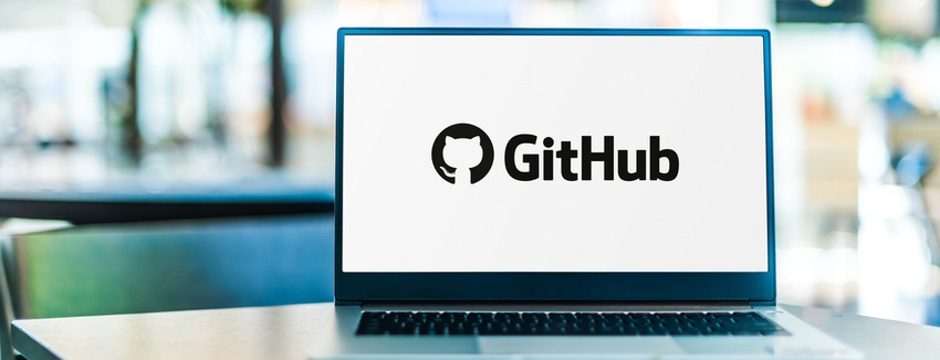 the GitHub logo on the screen of a laptop.