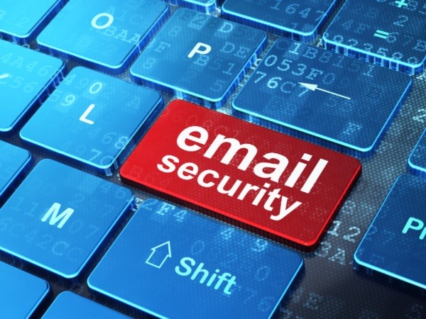 Image shows part of a computer keyboard with a red key with the words "email security" on it in white type instead of a letter