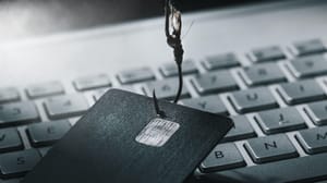 A credit card on a fishing hook, representing phishing A credit card on a fishing hook, representing phishing