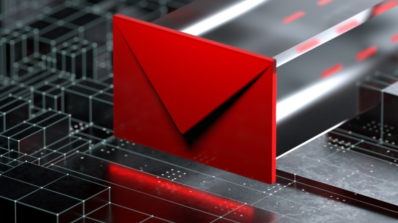 Red envelope slid inside black computer components Red envelope slid inside black computer components