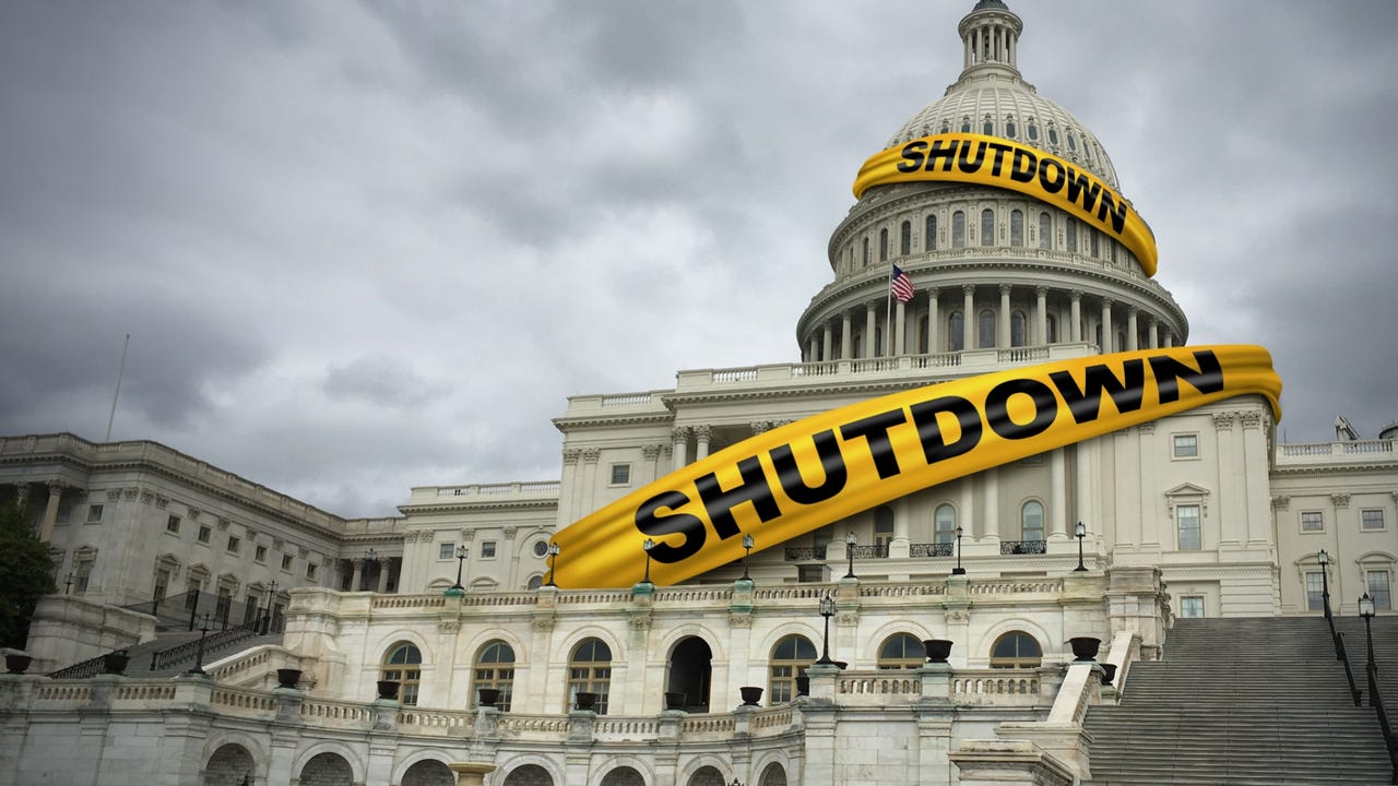 The US Capitol Building wrapped in a banner with "Shutdown" printed on it The US Capitol Building wrapped in a banner with "Shutdown" printed on it