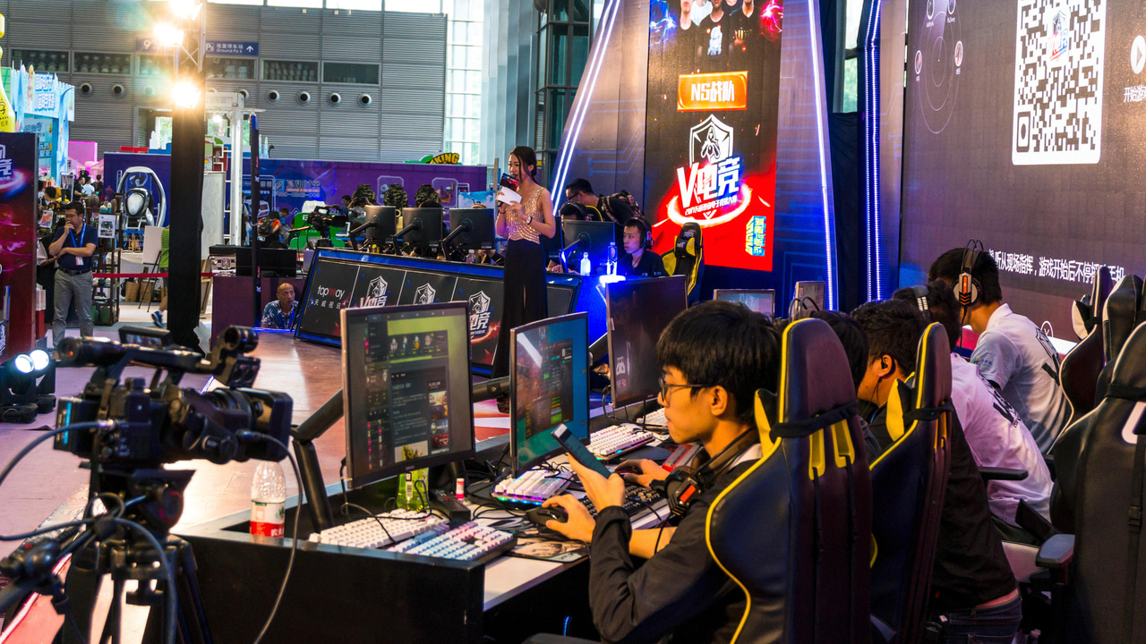 Video gamers in a multiplayer head-to-head competition at 2017 Shenzhen Game Fair Video gamers in a multiplayer head-to-head competition at 2017 Shenzhen Game Fair