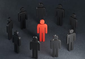 Abstract image of red human figure surrounded by black human figures Abstract image of red human figure surrounded by black human figures