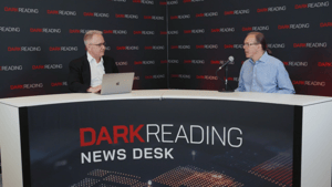 Two people talking at a news desk against a dark backdrop with "Dark Reading" written on it. Two people talking at a news desk against a dark backdrop with "Dark Reading" written on it.