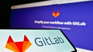 Smartphone with business logo of GitLab on screen in front of company website Smartphone with business logo of GitLab on screen in front of company website
