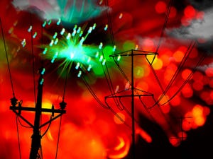 Green sparks rise from electrical wires, showing critical infrastructure in danger