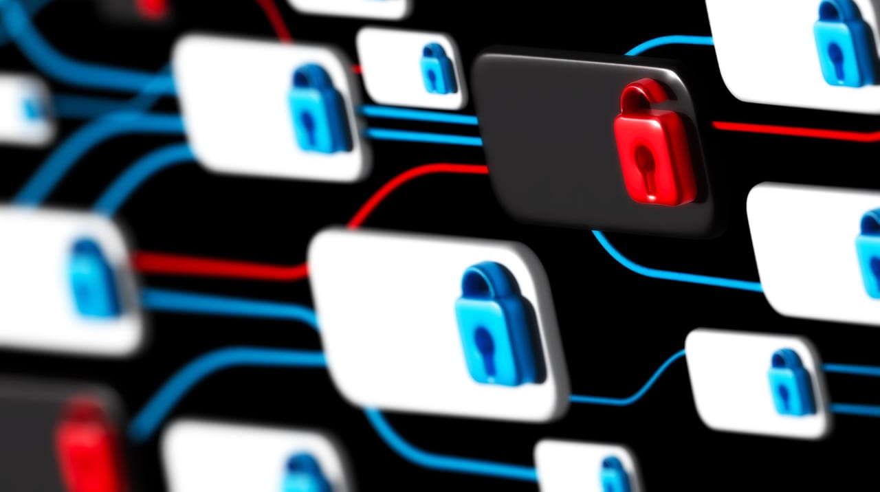 さまざまな青い錠前と1つの赤い開いた錠前が表示されたコンピュータ画面 さまざまな青い錠前と1つの赤い開いた錠前が表示されたコンピュータ画面
