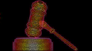 A gavel, represented in colorful binary code A gavel, represented in colorful binary code