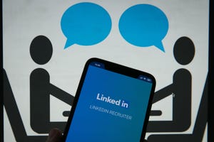 A person holding a phone with the LinkedIn app open; two animated people speaking in the background