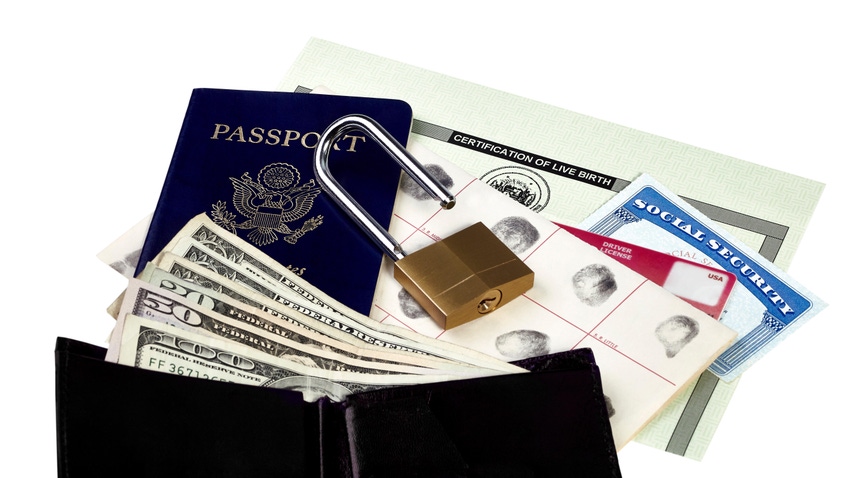 Various forms of identification, including a passport, birth certificate, fingerprints, and social security card, with an open padlock on top.