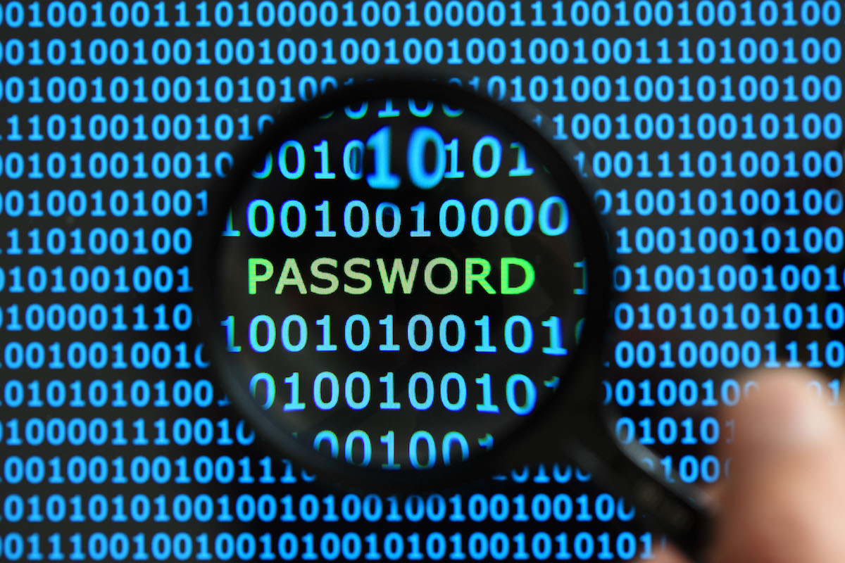 A compass zooming in on the word "password" against a backdrop of computer code. A compass zooming in on the word "password" against a backdrop of computer code.