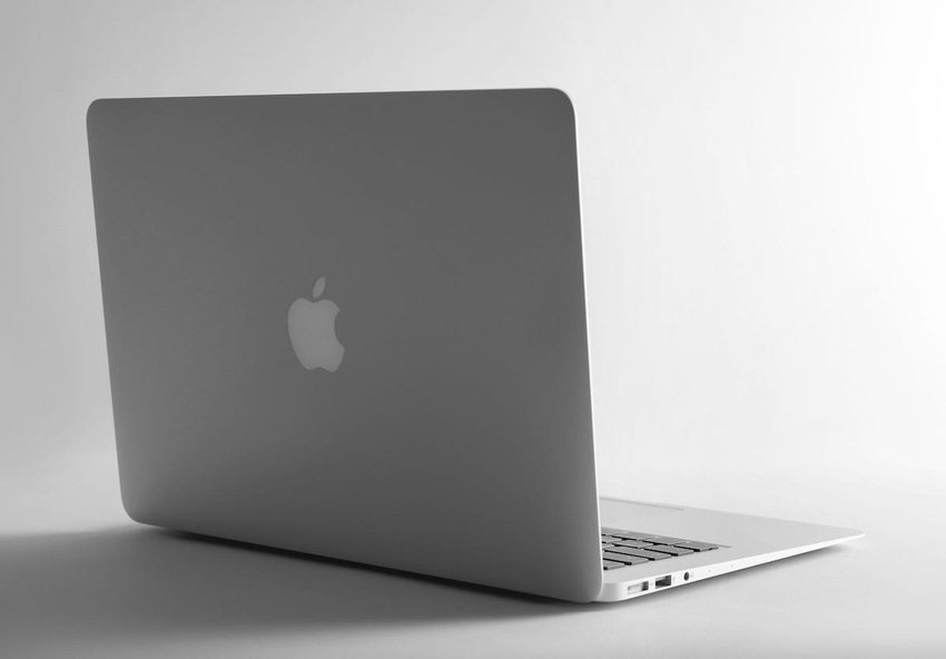 an open silver macbook pro laptop