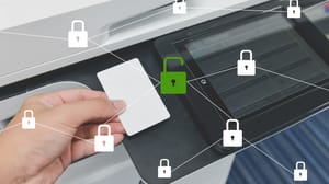 A hand using smart card to print a document overlayed with locked and unlocked key icons A hand using smart card to print a document overlayed with locked and unlocked key icons